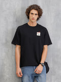 Solid Oversized T-Shirt With Printed Canvas Patch And Raw Edge Detail | Black