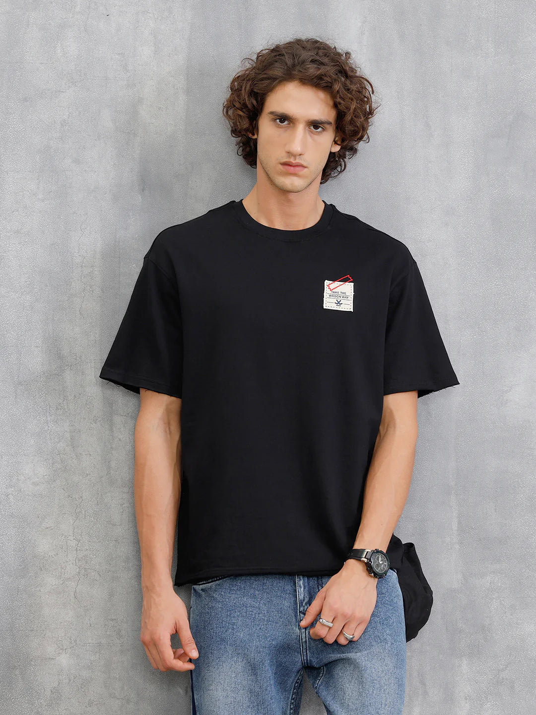 Solid Oversized T-Shirt With Printed Canvas Patch And Raw Edge Detail | Black