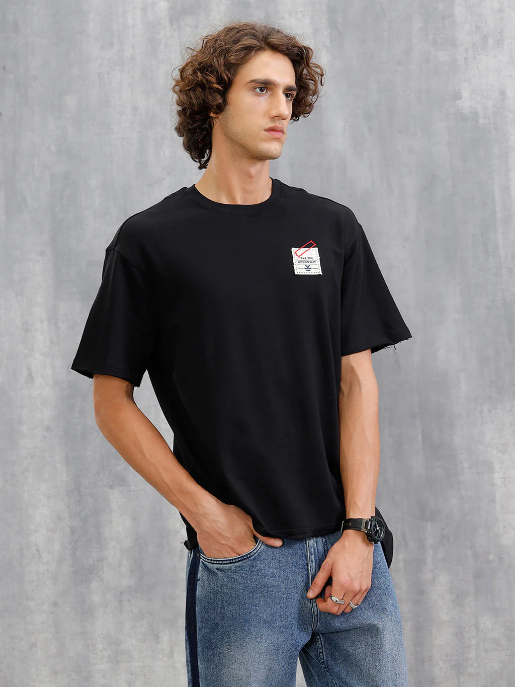 Solid Oversized T-Shirt With Printed Canvas Patch And Raw Edge Detail | Black