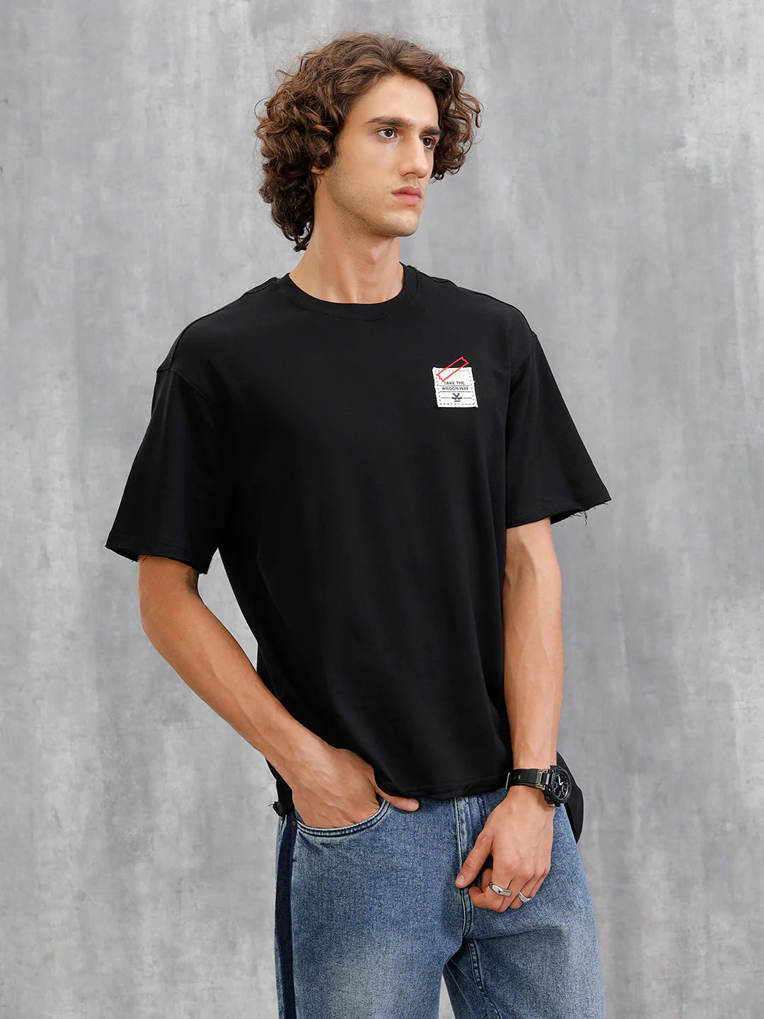 Solid Oversized T-Shirt With Printed Canvas Patch And Raw Edge Detail | Black